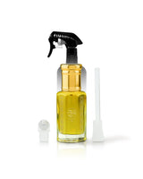 arabian dates perfume oil bottle beside roller and stick shows against white background