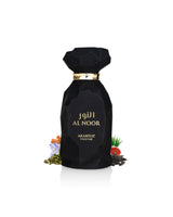 arabiyat prestige al noor perfume bottle surrounded by fragrance notes like cardamom and tonka shows against white background