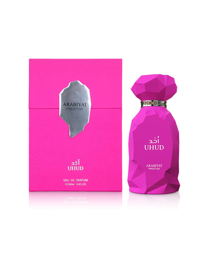 arabiyat prestige uhud perfume bottle shows beside its box against white background