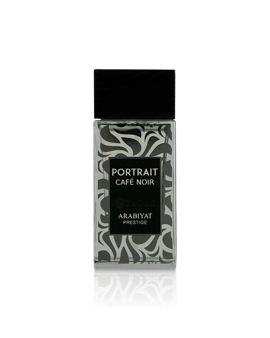 A rectangular glass bottle of Arabiyat Prestige Portrait Cafe Noir fragrance, featuring a black cap and a black label over a gray and white abstract patterned background, set against a plain white background with a soft reflection below.