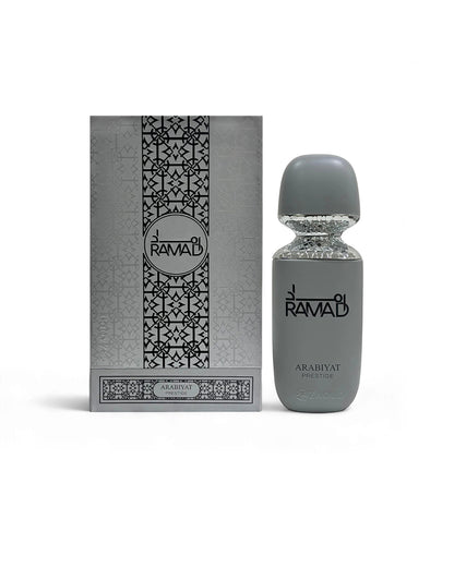 arabiyat prestige ramad perfume gray bottle shows beside packaging against white background