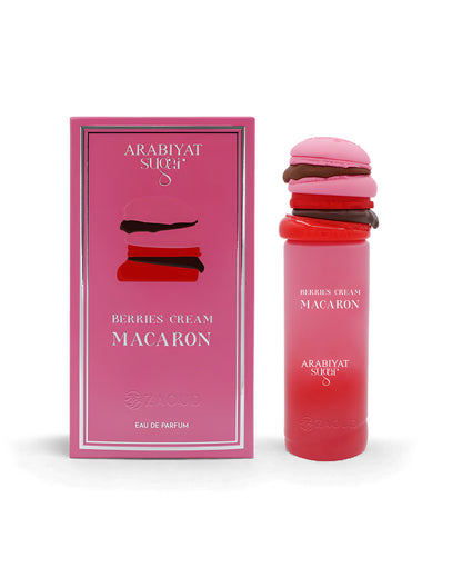 Pink macaron-shaped arabiyat sugar berries cream macaron perfume bottle shows beside its packaging against white background