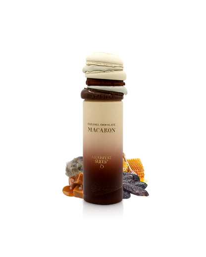 Macaron-shaped container with arabiyat sugar Caramel Chocolate Macaron perfume bottle surrounded by caramel and tonka beans on a white background