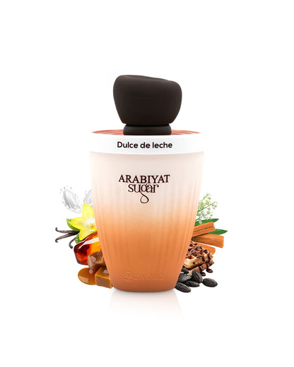 arabiyat sugar dulce de leche perfume bottle surrounded by fragrance notes like caramel and tonka shows against white background