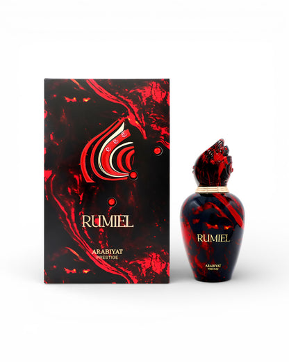 arabiyat prestige rumiel perfume bottle beside box shows against white background