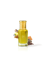BALZAC PERFUME OIL bottle filled with golden yellow liquid, topped with a metallic gold cap, shown on a white background with dried botanical ingredients arranged around the base.