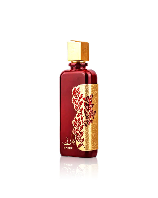 ARD AL ZAAFARAN BAREZ Red and gold perfume bottle with intricate design on a white background