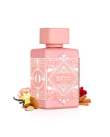 badee al oud noble blush perfume bottle surrounded with fragrance notes like almond and vanilla shows against white background