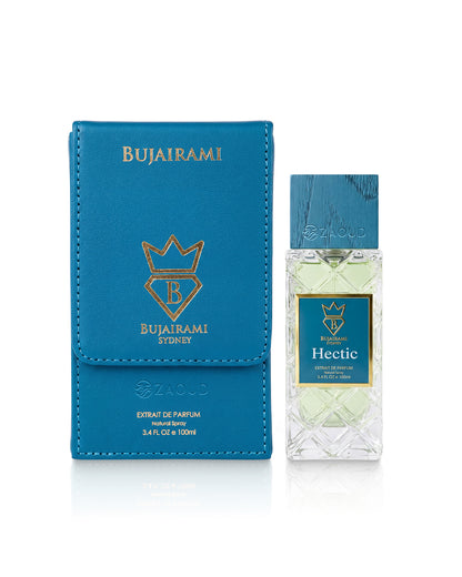 Bujairami Hectic Extractive Eau de Parfum bottle next to its blue textured leather box, featuring gold foil branding on a white background.
