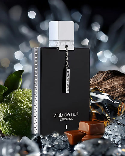 CLUB DE NUIT PRECIEUX 1 perfume bottle photograph surrounded by caramel and bergamot and ice cubes against blurry background