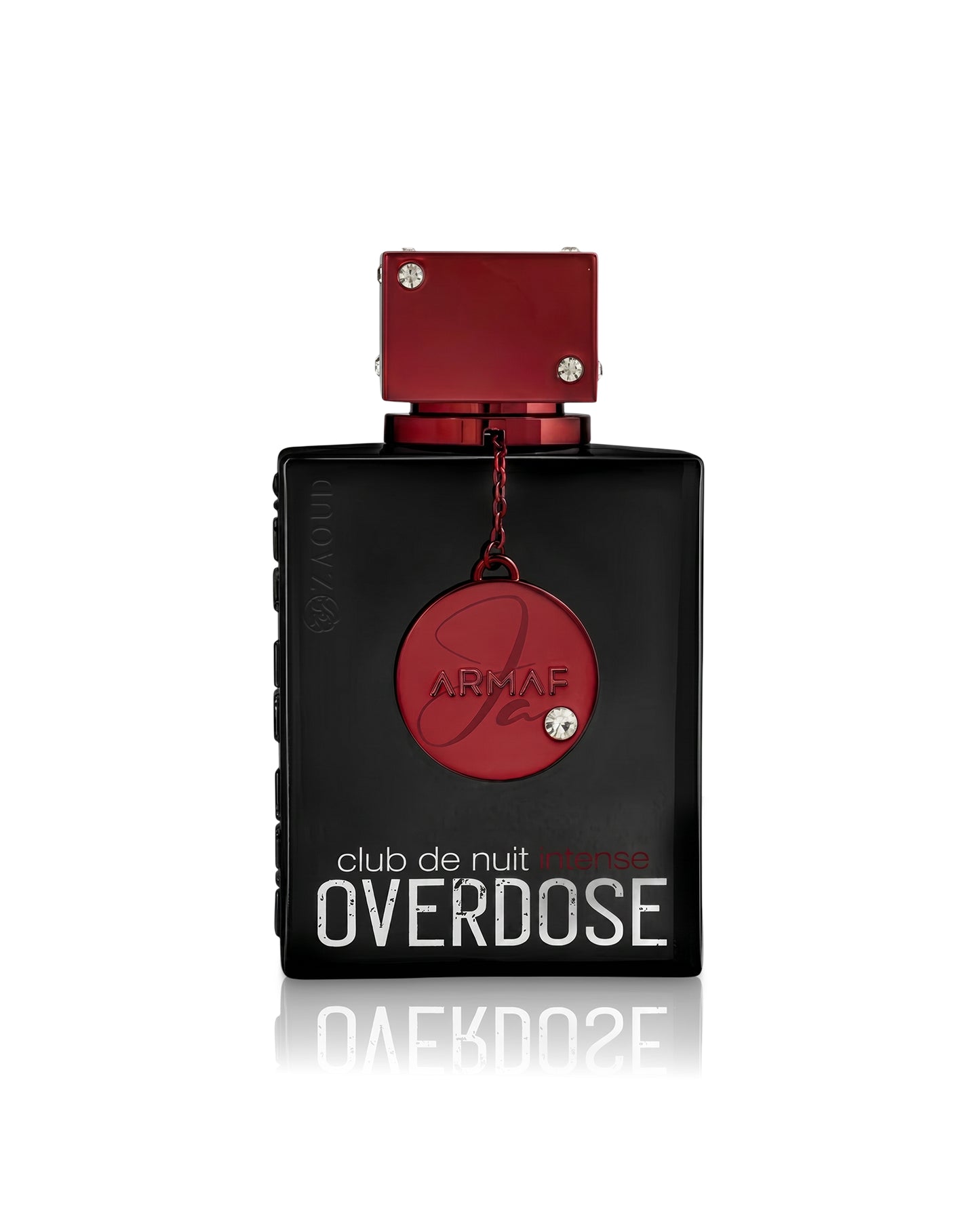 Armaf Club de Nuit Intense Overdose perfume bottle, featuring a matte black rectangular body with a metallic red cap and a hanging red circular medallion, set against a plain white background with a soft reflection.