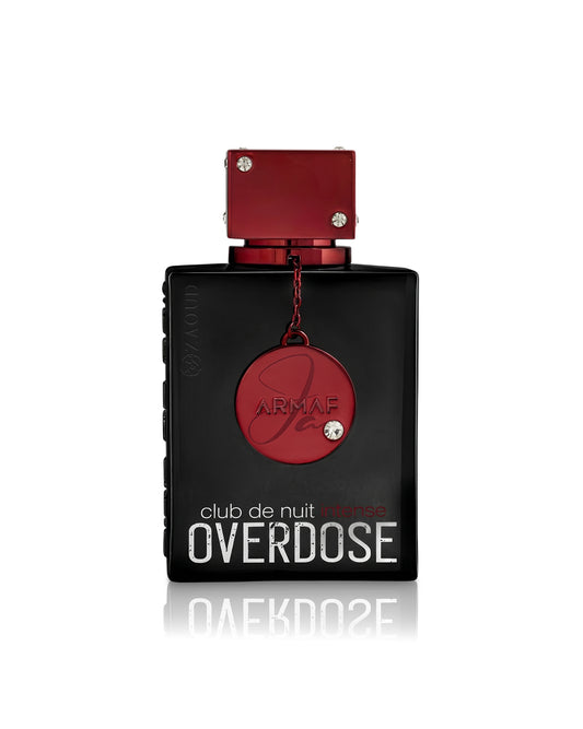 Armaf Club de Nuit Intense Overdose perfume bottle, featuring a matte black rectangular body with a metallic red cap and a hanging red circular medallion, set against a plain white background with a soft reflection.