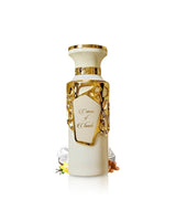 fragrance world creme of clouds perfume bottle surrounded with fragrance notes like vanilla and cream shows against white background