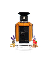 fragrance world dark as wood perfume bottle surrounded with fragrance notes like barries and lavender shows from behind the bottle against white background