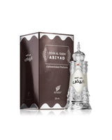 Dehn al oudh abiyad perfumed oil bottle and box against white background