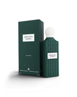 Emerald Soul Diamond Eau de Parfum bottle and its matching dark green packaging box, featuring a textured diamond pattern and a white spherical cap, set against a clean white background.