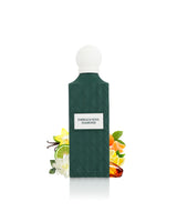 emerald soul diamond perfume bottle surrounded with fragrance notes like amber and orange shows against white background