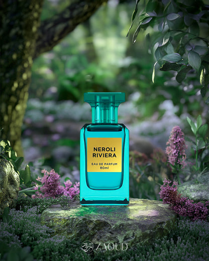 fragrance world neroli riviera perfume bottle photograph over rock inside jungle surrounded with flowers and green trees.