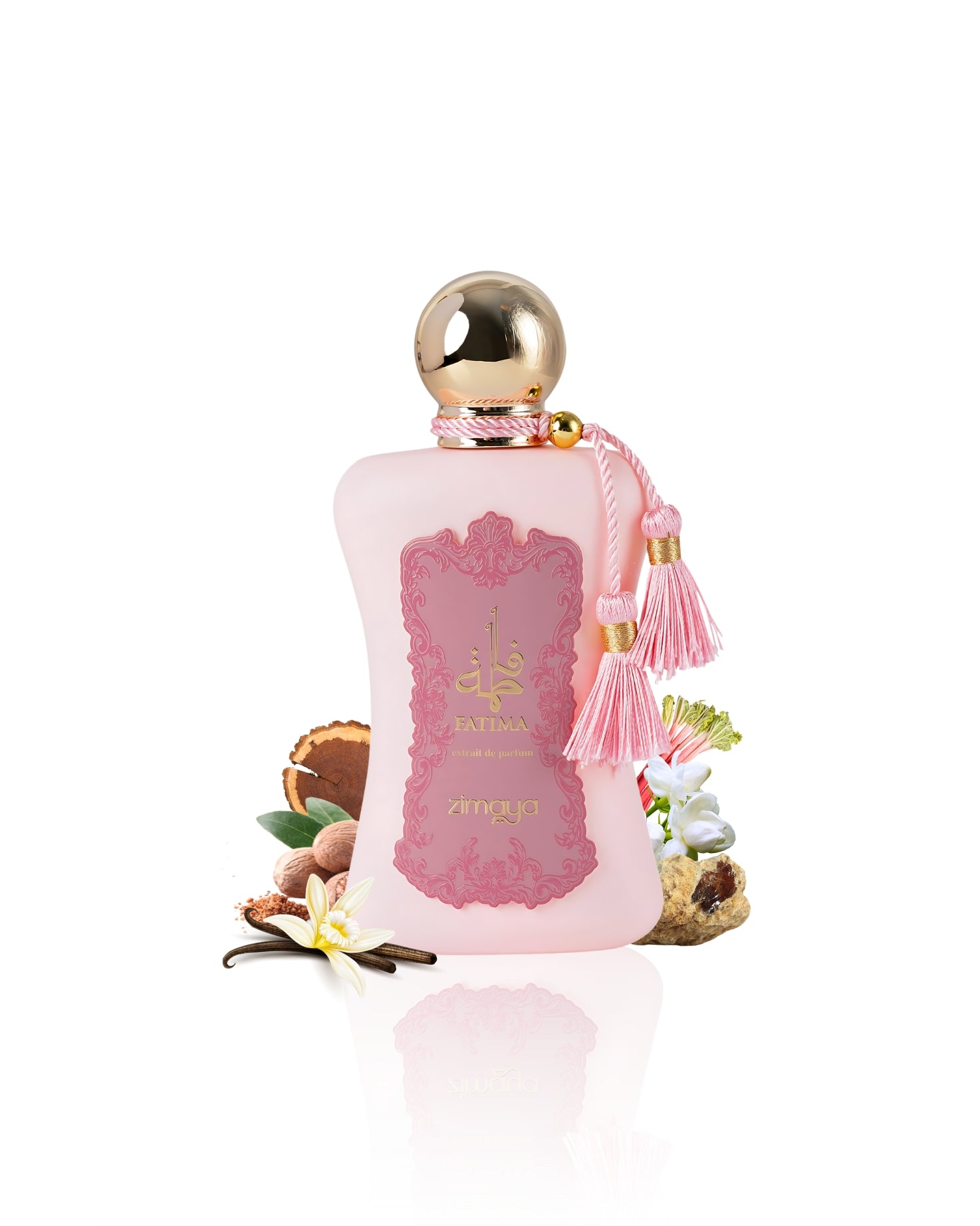 Fatima extrait de parfum perfume bottle surrounded by nutmeg vanilla against white background