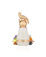 french avenue fierte luna White bottle surrounded by fragrance notes like tobacco and honey with gold cap on a white background