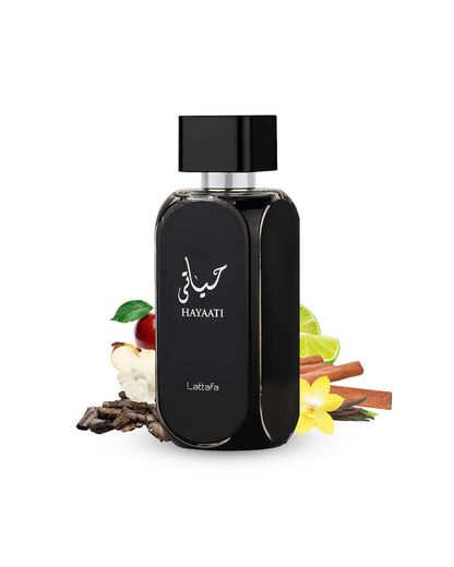 hayaati black edp by lattafa perfume bottle surrounded with its ingredients like apple and vanilla shows from behind the bottle against white background