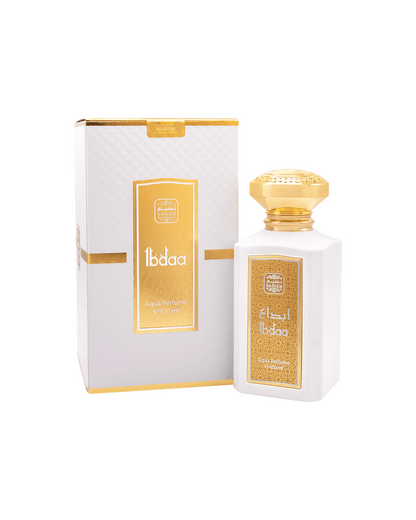 ibdaa aqua parfum by naseem perfume bottle beside its box shows against white background