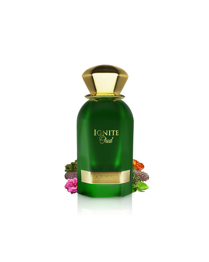 ahmed al maghribi ignite oud perfume bottle surrounded with fragrance notes like amber and moss shows from behind the bottle against white background