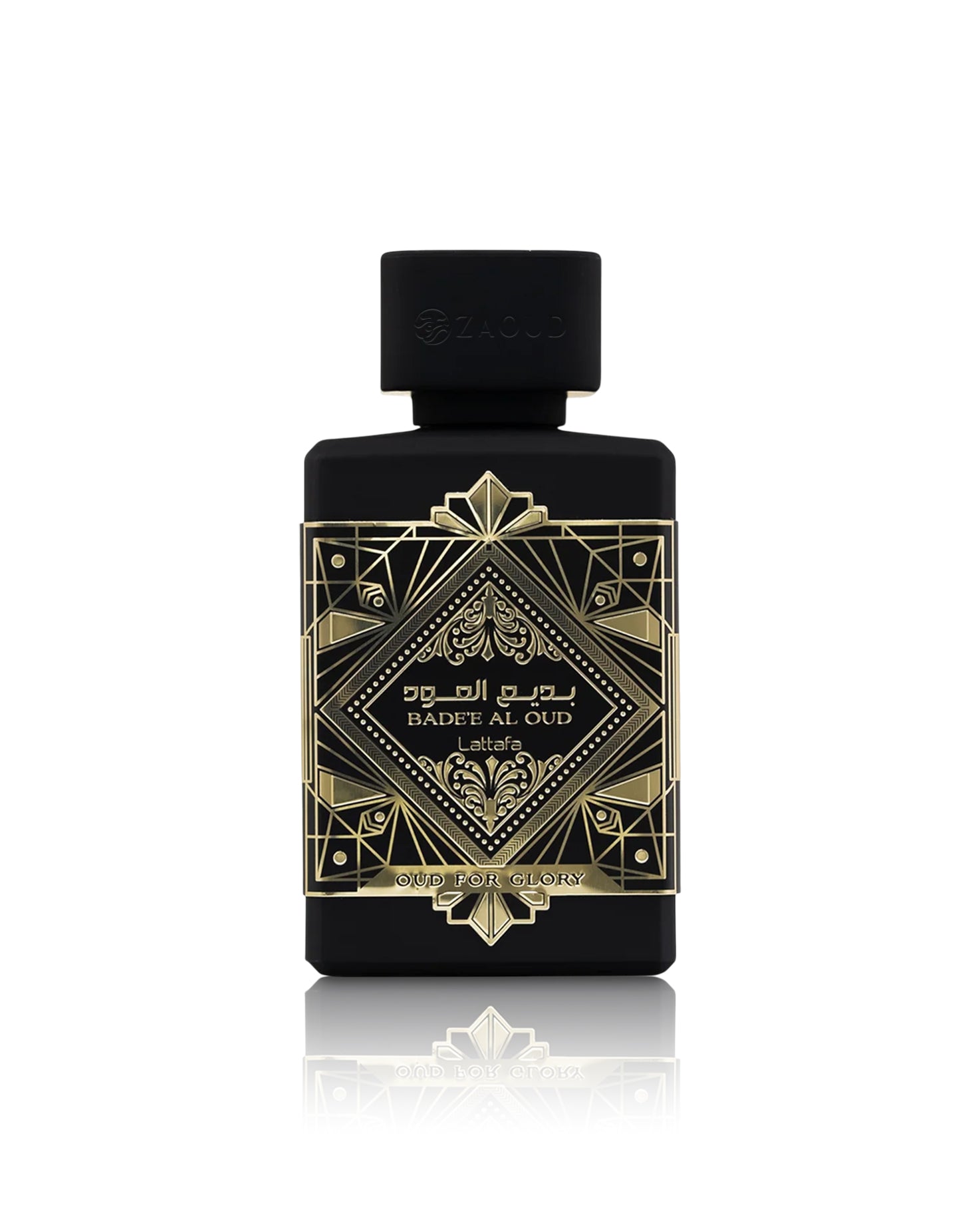lattafa badee al oud oud for glory perfume bottle with a black cap, featuring an ornate gold geometric label with Arabic and English text, set against a clean white background with a soft reflection below.