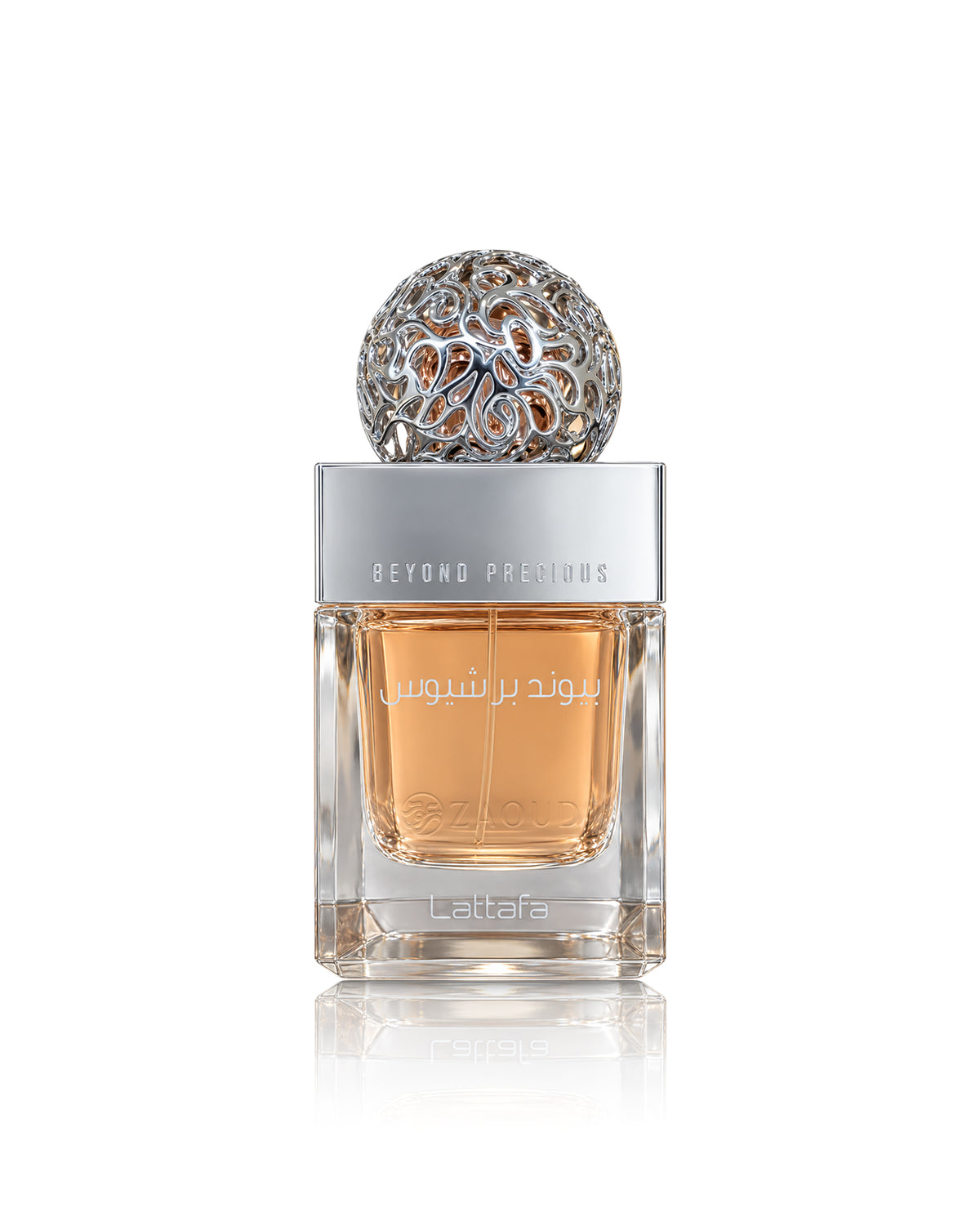 Lattafa Beyond precious perfume bottle with amber liquid, a silver cap, and a decorative silver top, shown on a white background with a reflection.