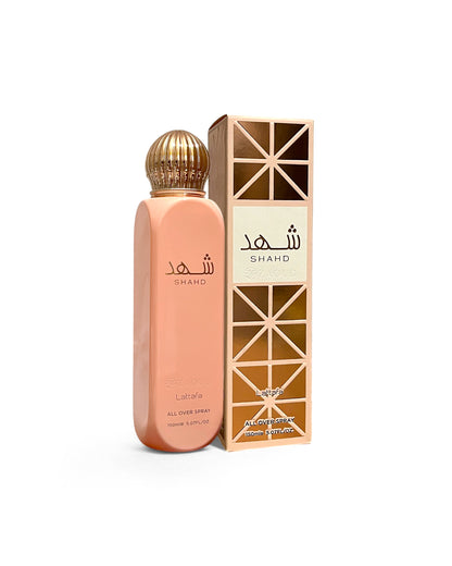 lattafa shahd all over spray bottle shows beside its box frontside against white background