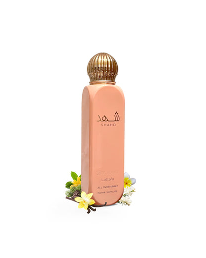 lattafa shahd all over spray bottle surrounded by fragrance notes like tuberose and vanilla shows against white background
