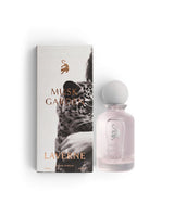 Laverne Musk Garden Eau de Parfum bottle and packaging box, featuring a light pink glass bottle with a white spherical cap and a white box decorated with a black and white leopard print and gold lettering.