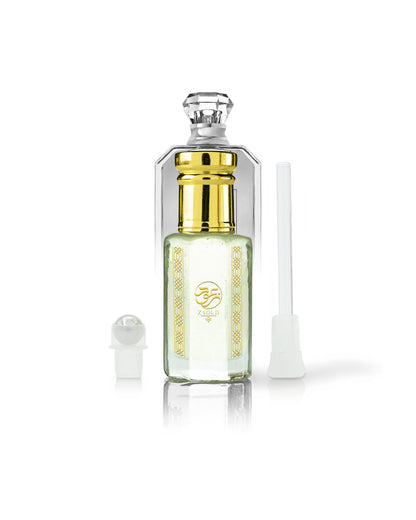 lunar musk perfume oil bottle beside roller and stick shows against white background