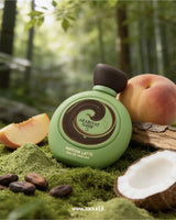 Green perfume bottle with brown cap on a natural background with peaches and coconut