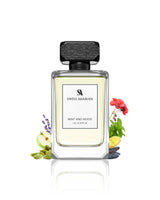 Swiss Arabian Mint and Wood perfume bottle with floral elements on a white background