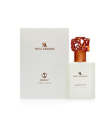 swiss arabian musk 07 extrait perfume bottle shows beside its box against white background