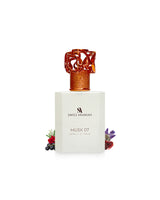 swiss arabian musk 07 extrait perfume bottle surrounded with fragrance notes like black current and musk with rose shows from behind the bottle against white background