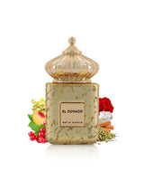 matin martin el dorado perfume bottle surrounded by fragrance notes like peach and rose shows against white background
