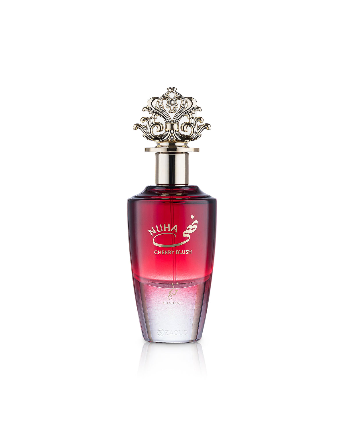 A bottle of Nuha Cherry Blush perfume with a red gradient body, a silver metallic cap, and gold lettering, set against a plain white background.