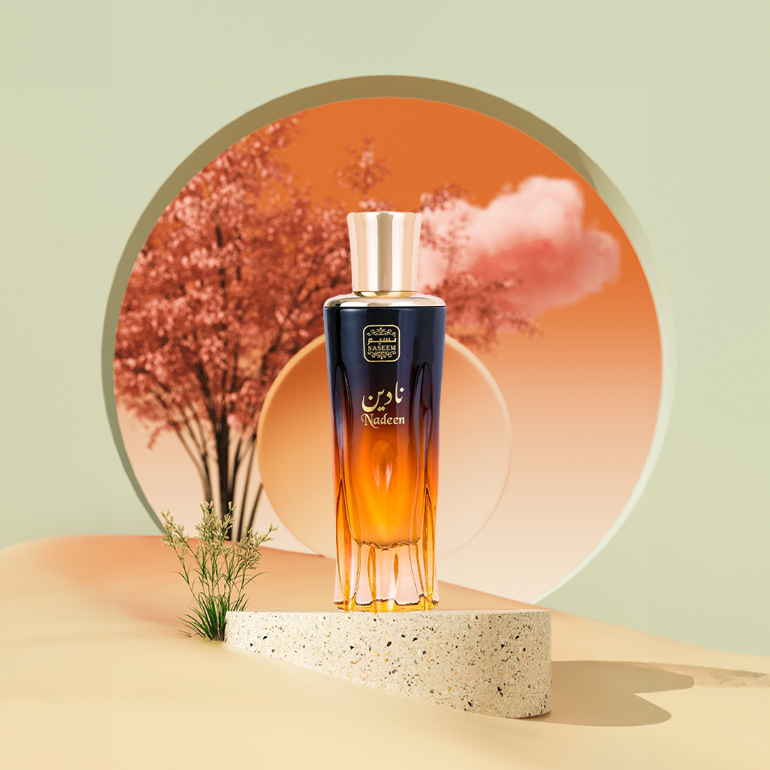 nadeen aqua parfum by naseem perfume bottle photograph over a round piece of ceramic with a oriental scenery like sunset