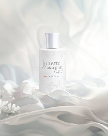 Not a perfume edp perfume bottle photograph against white fabrics