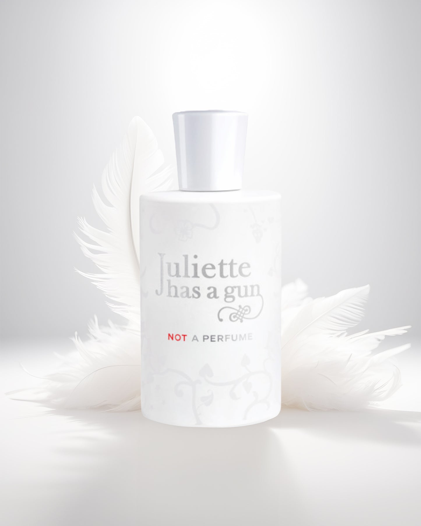 Not a perfume edp perfume bottle photograph against white feather