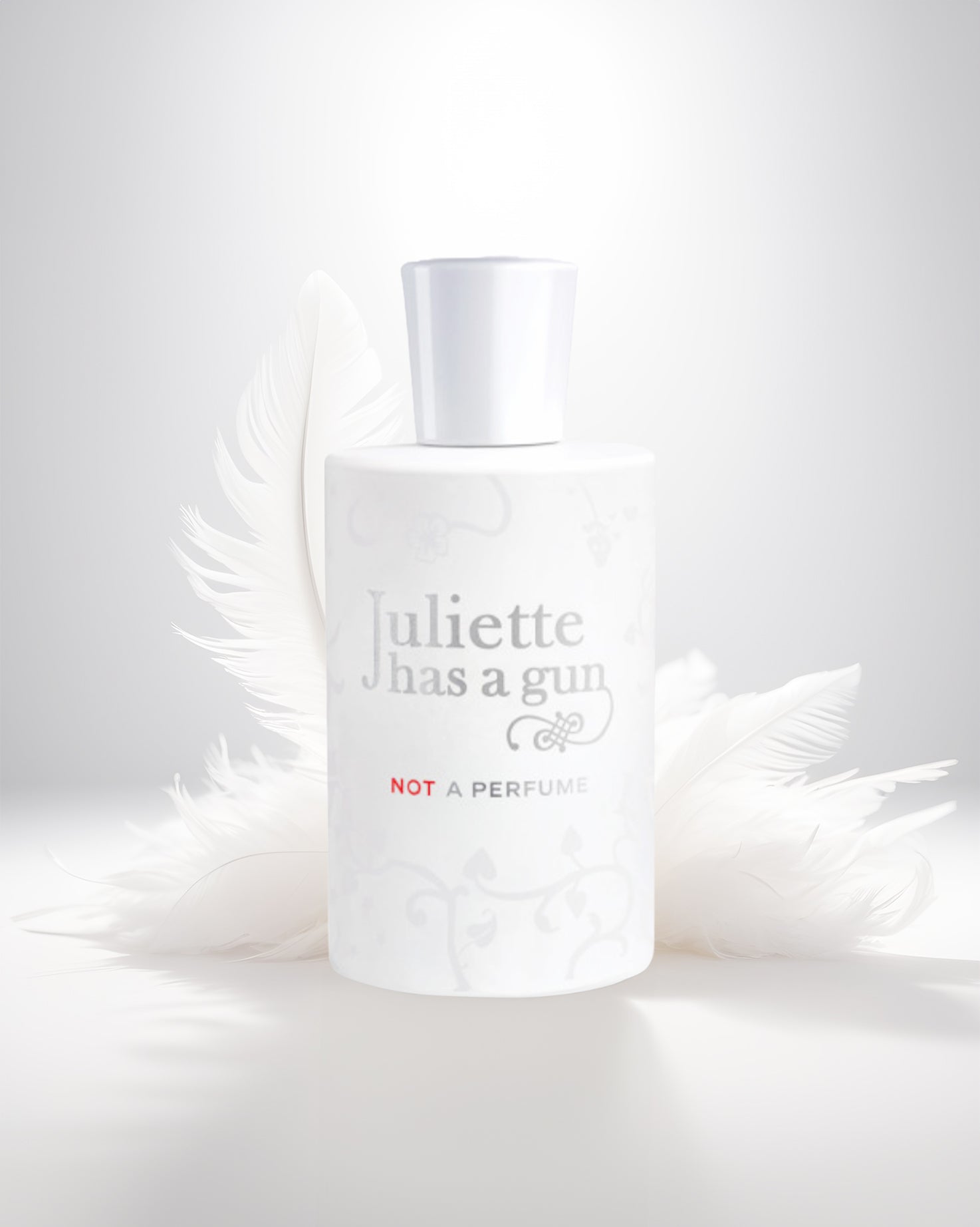Not a perfume edp perfume bottle photograph against white feather