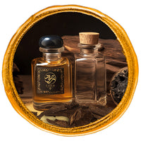 Oud perfume bottle surrounded bycambodian oud chips with dark background