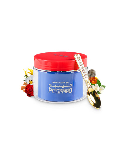 al haramain philippino bakhoor container surrounded with its ingredients like rose and amber with many others and a spoon shows against white background