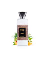 khadlaj private blend musk ice perfume bottle surrounded with fragrance notes like peach and orange shows against white background