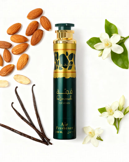 qimmah for women air freshener bottle photograph beside almond and tonka against white background