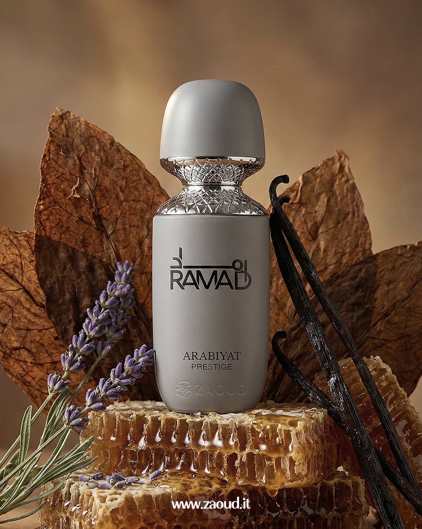 Perfume bottle with 'RAMAD' branding on a honeycomb and dried leaves background