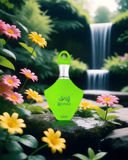 Raunaq eau de parfum green perfume bottle photograph over a wet rock infront of water fall surrounding with colourful wild flowers