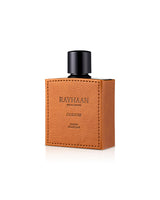 rayhaan corium Perfume bottle with brown leather case and black cap on a white background